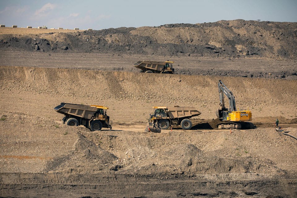 Material is removed from the upstream side of the dam core trench, August 2021.