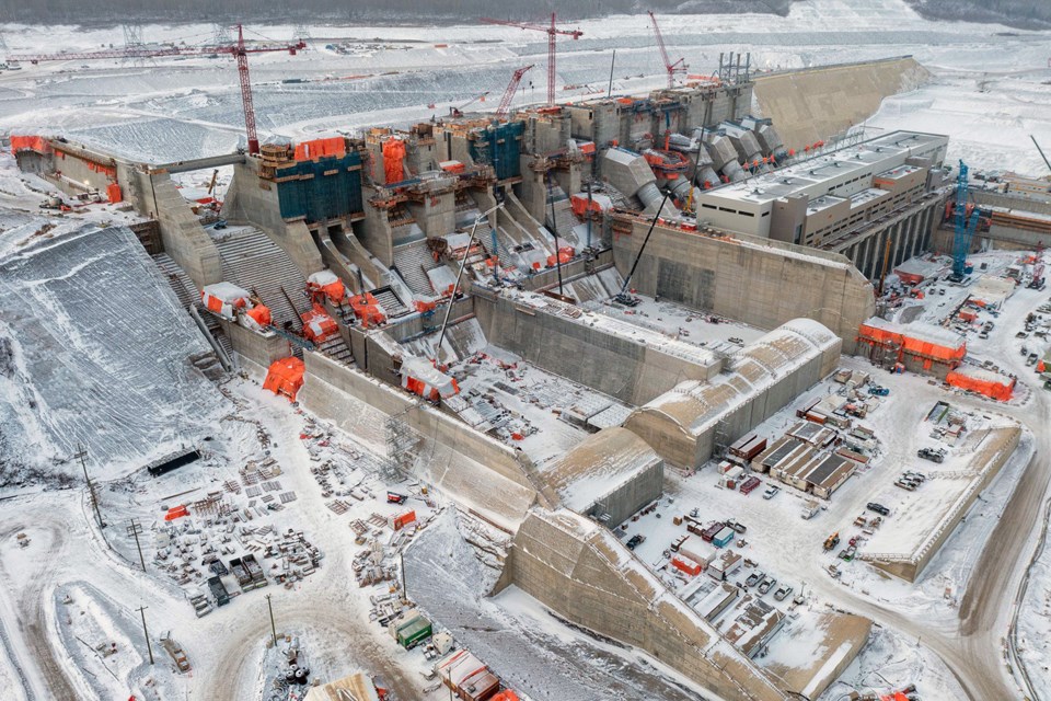 From left to right: construction of the Site C spillways and stilling basin weirs, penstocks, powerhouse and operations building, November 2022.