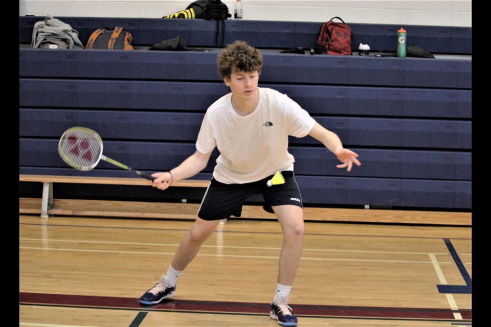 North Peace Secondary badminton player Alfred Roba returns service during the boy’s final of an exhibition match at the school April 23, 2022. Roba and the rest of his teammates will play in the zone championships May 13-14 in Dawson Creek.