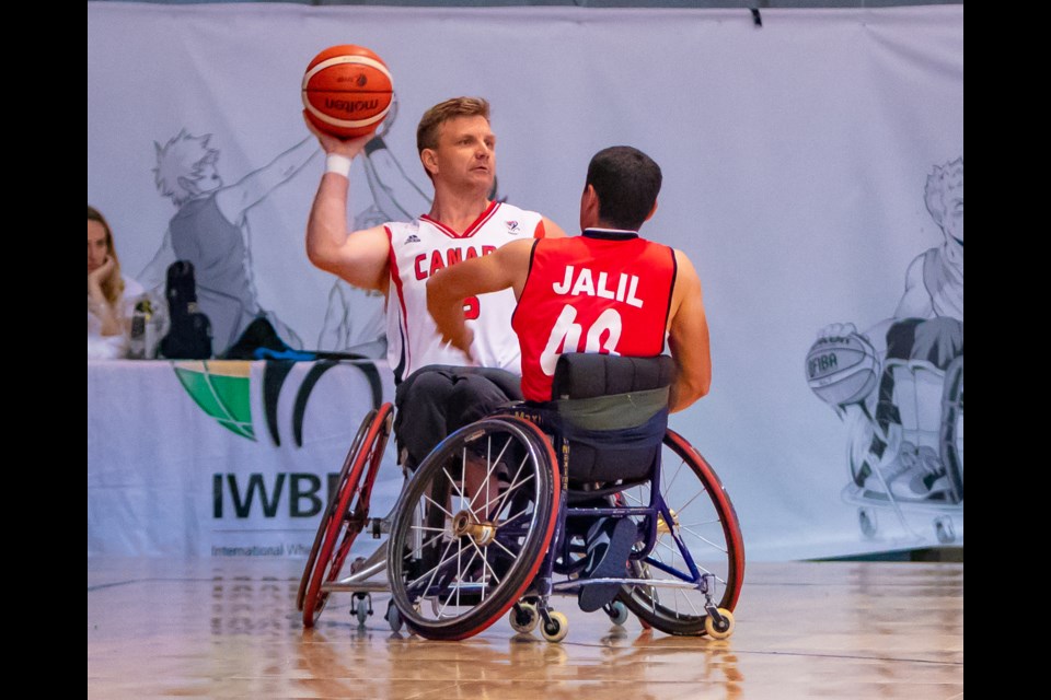 Bo Hedges looks to make a pass while facing Iran in the 2018 World Wheelchair Basketball Championships.