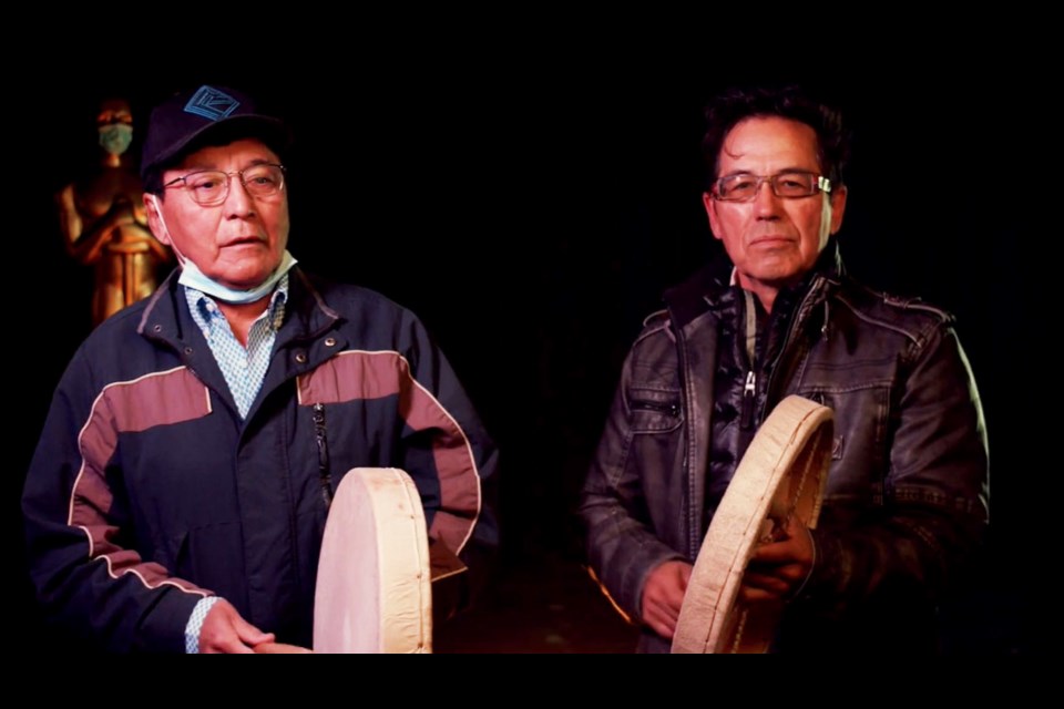 Doig River First Nation members Sam Acko and Garry Oker started the night off with a drum performance and honour song. 
