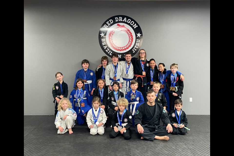 Group photo of Red Dragon competitors, in no particular order: Matheus Juister, Josiah Henry, Gabriel Henry, Scarlett Desor, Frazetta Laprairie, Kammy Steiner, Lea Matsalla, Jhuztine Orcena, Damian Cholmondeley, Brooklyn Jodoin, Levi McLain, Aurora Allouche, Sullivan Laliberte, Olive Shishido, Finn Shishido, Dylan Garvais, Argyle McLean, Liam Jones, Conor Soule, Gabriel Soule, Zayden MacWilliam, Mika Hockman, Kaleb Green, Able Green, Zayden Zytnyk, and Noel Davies.