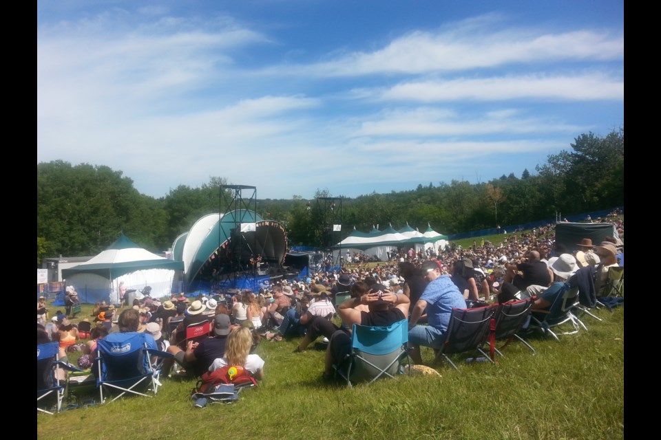 Skies were blue, temperatures were beyond warm...and folk fest patrons loved it all up. Photo: Lucy Haines