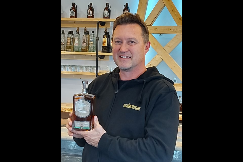 Rig Hand Distillery owner Geoff Stewart holds a bottle of the Rocking R whisky chosen as the Official Speaker's whisky in Ottawa. Photo: Ashley Geddes
