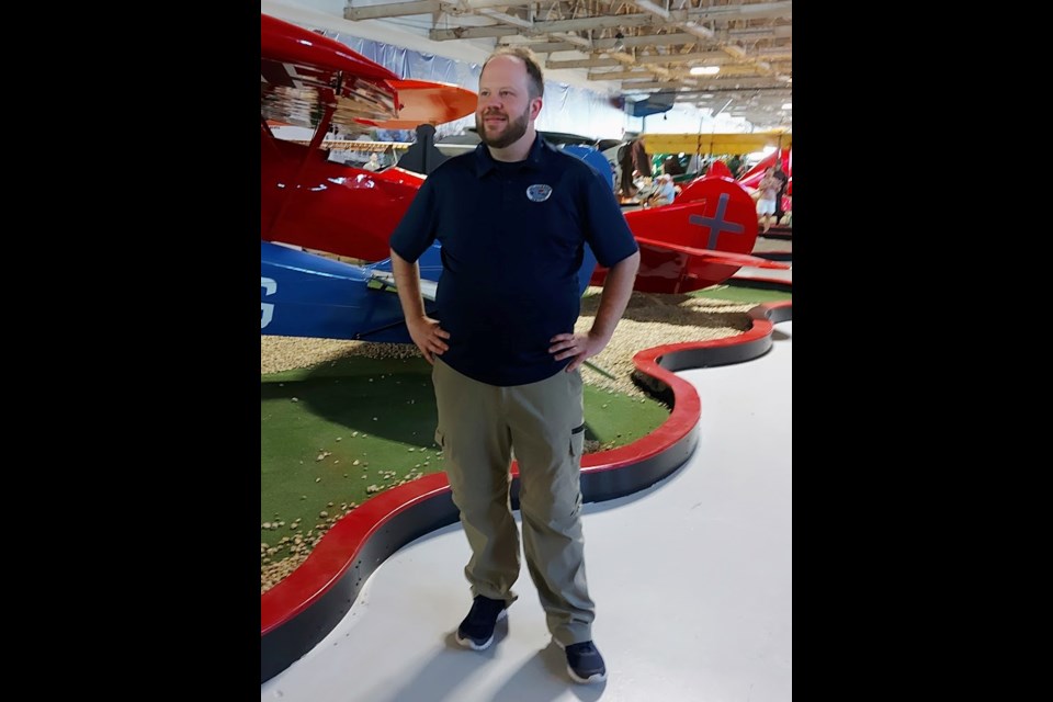 Alberta Aviation Museum curator Ryan Lee amid the collection of historic aircraft. Photo: Ashley Geddes