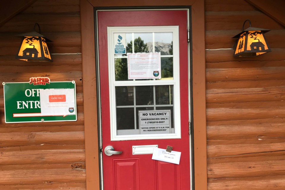 Signs on the office at the Jasper Park Gates Resort and RV advise visitors about COVID-19 protocols. Photo supplied