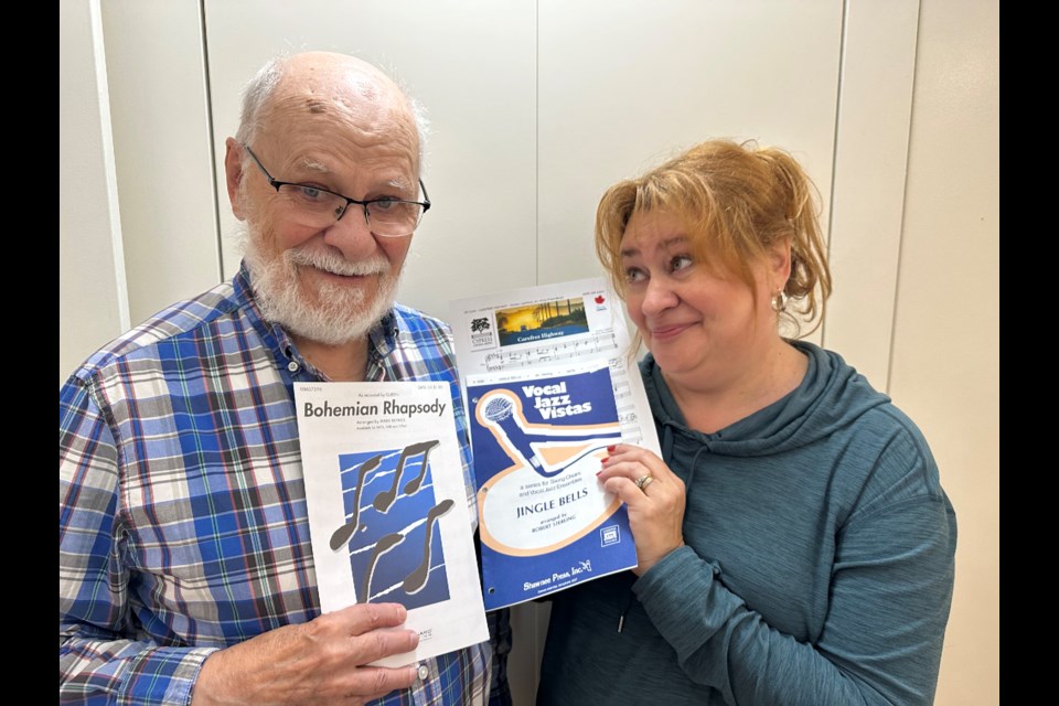 Eric Mierau, 85, with daughter Criselda, who is starting up new choirs that her dad can be part of. The pair will make music together for as long as possible, says the busy conductor and artistic director. Photo supplied.