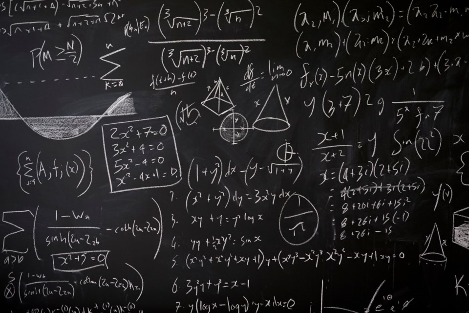 blackboard-with-maths-statistics-equations-and-ide-PZ6Q57W