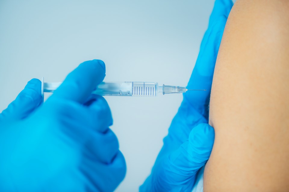 woman-getting-a-flu-vaccine-46RPJSB