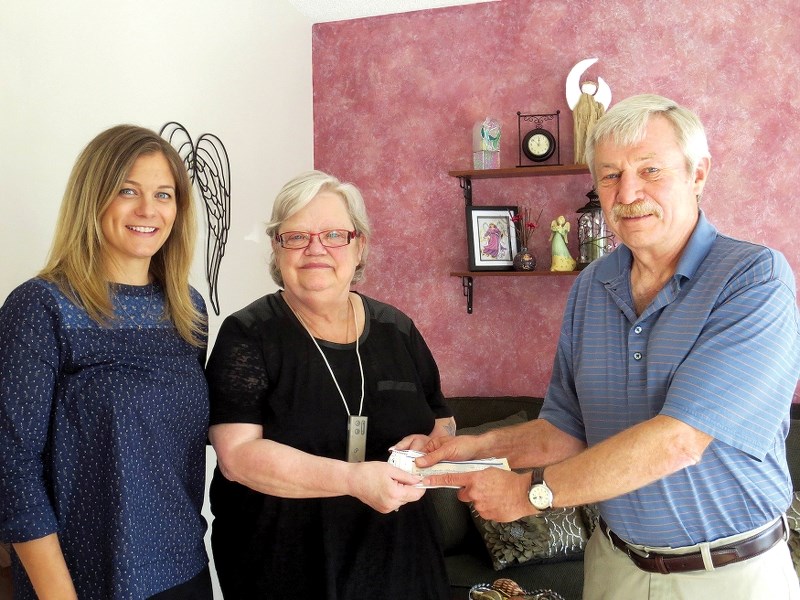 Donations co-ordinator Gary Goertz present a cheque to Zebra Child Protection Centre.