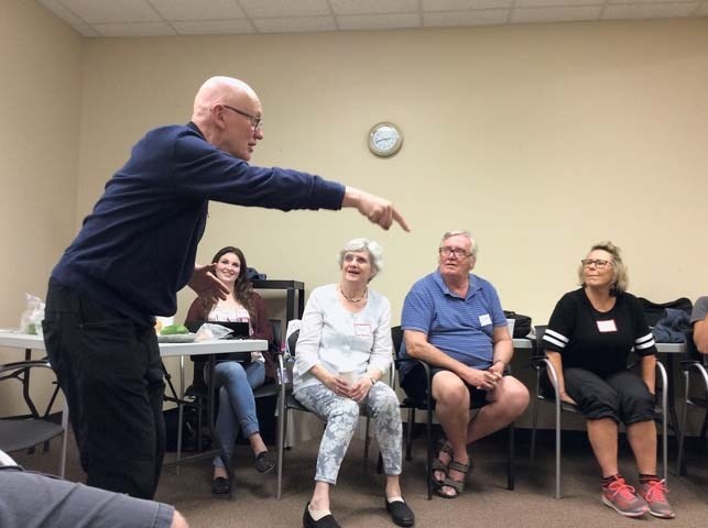 David Barnet, artistic director of GeriActors and Friends, holds his fellow performers captive with an improvised story durin rehearsal.