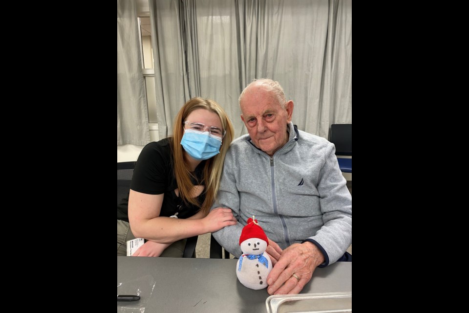 Meagan Chapman, a recreation therapy attendant, visits with Ted Gajewski, a resident at the St. Michael's Long Term Care facility in Edmonton. Photo submitted.