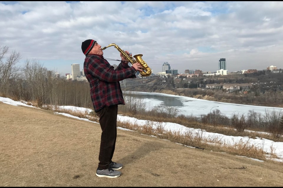 PJ Perry delivers a cool solo performance with his alto saxophone on an early spring day in Edmonton. Photo; Gary Poignant