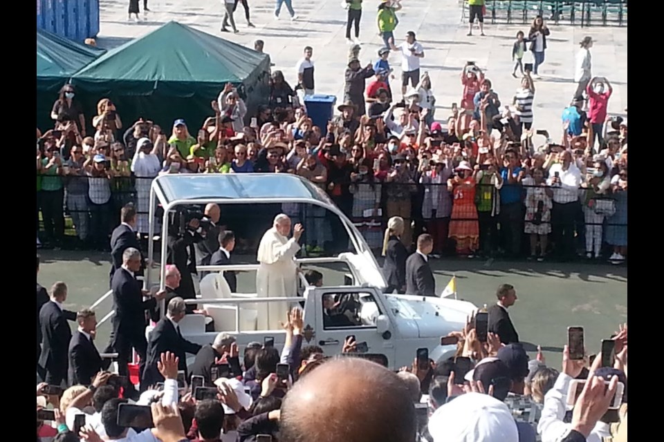 The Popemobile allowed the faithful to get a bit closer to the Pontiff, stretching out babies and little ones for kisses and blessings. Photo: Lucy Haines