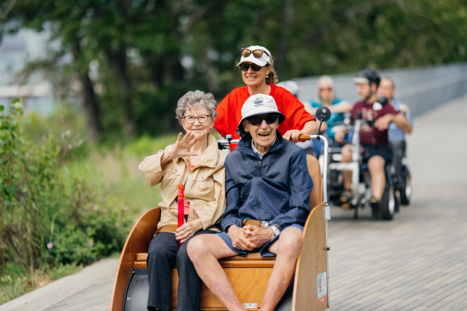 Cycling Without Age volunteers take seniors out for warm weather bike rides (trishaw style) around Calgary. Cyclist is Aimee Trudel. Seated at front are Pat Trudel and Phyllis Messier (who just met).
Photo supplied.