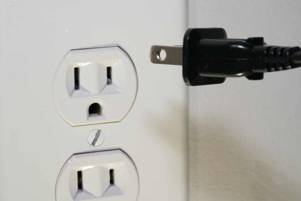 unplugging-from-an-electrical-outlet