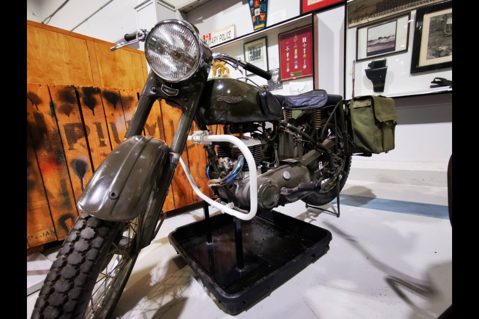 A 1956 Triumph motorcycle used by the Provost Corps (military police) is shown at the Base Borden Military Museum. Behind it is an unopened crate containing a 1957 Triumph motorcycle.