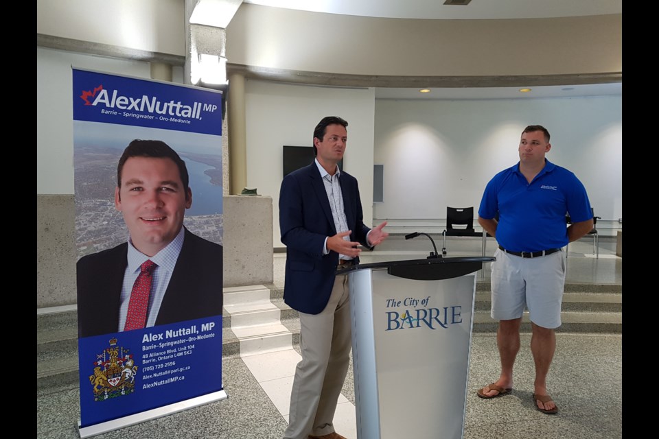 Barrie Mayor Jeff Lehman, left, speaks about the Canada Summer Jobs Program as MP Alex Nuttall (right) looks on. Shawn Gibson for BarrieToday