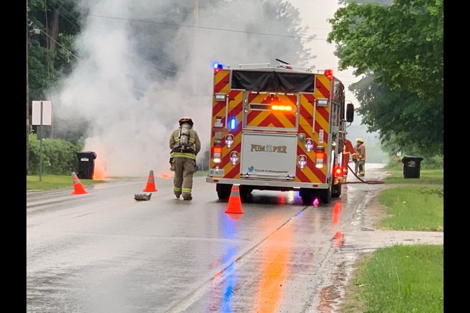 Crews from Springwater Fire & Emergency Services closed traffic on St. Vincent Street, between Holloway Lane and Noraline Avenue in Midhurst, on Monday, after a branch fell on a hydro line.