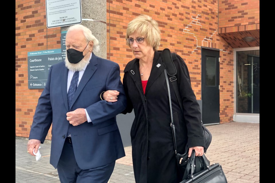 Paul Sadlon leaves the Barrie courthouse with defence lawyer Karen Jokinen at the end of the first day of his sexual assault trial, Monday.