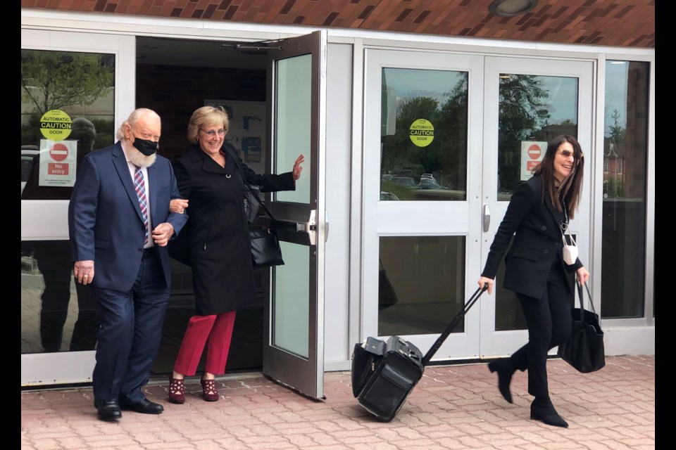 Paul Sadlon leaves the Barrie courthouse Wednesday with his lawyers Karen Jokinen, centre, and Francesca Yaskiel, after taking the witness stand in his own defence.