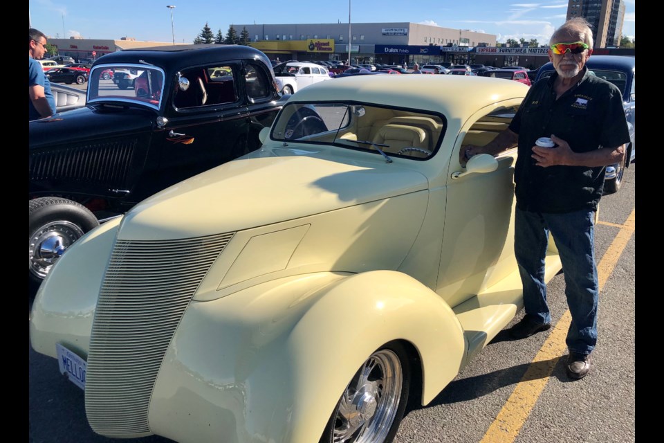 Ray Klowak shows off his 1937 Ford at the Bayfield Mall parking lot on a recent Saturday night.