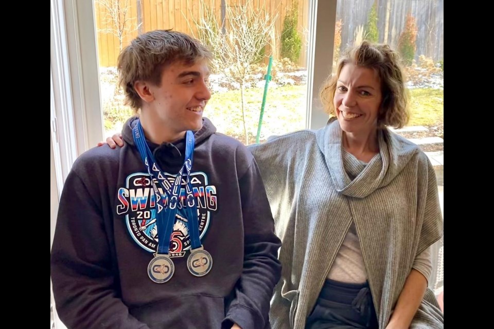 Jonah Solem and his mom, Tina, celebrate his success at the recent OFSAA swim meet where he won two silver medals 13 months after undergoing emergency brain surgery.