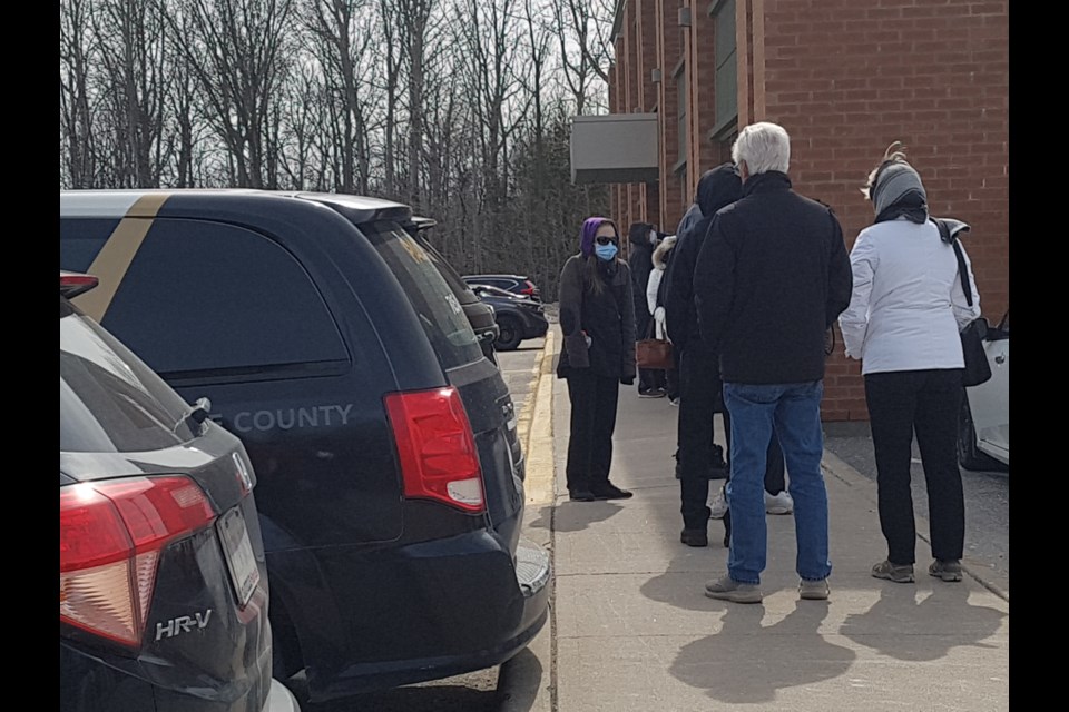 The line-up outside the 490 Huronia Rd. COVID-19 assessment centre was long before the 2 p.m. opening, Monday, March 16, 2020. Shawn Gibson/BarrieToday