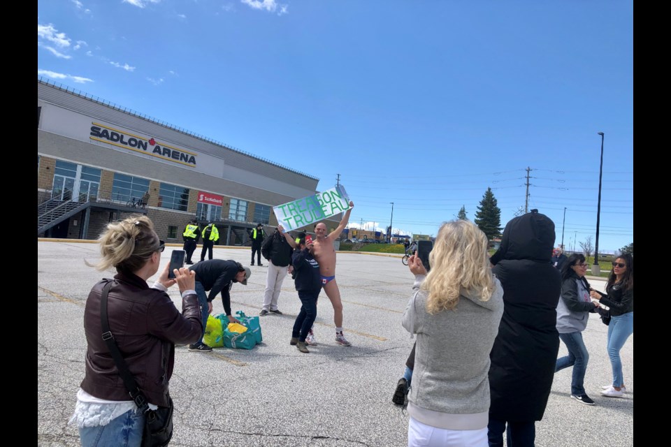 Thong-wearing Weldon Hachey, who is running to become the city's mayor, is shown in a file photo from May at a protest outside the Sadlon Arena in south-end Barrie. 