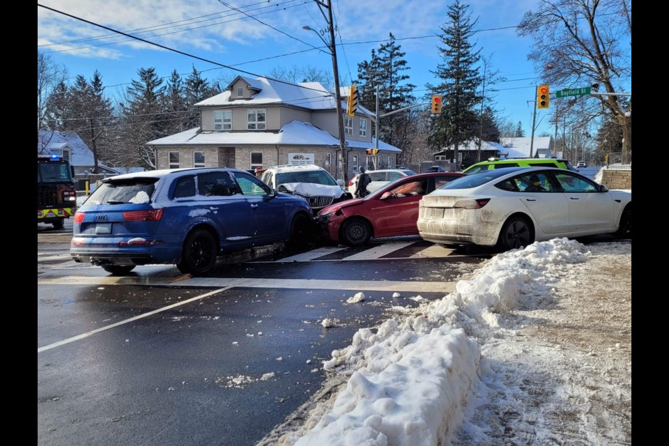 Emergency personnel respond to a crash at the intersection of Bayfield Street and Grove Street East on Friday, Jan. 27.