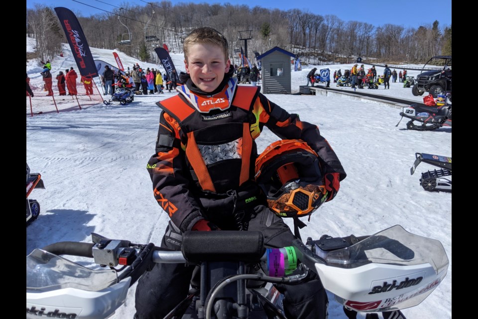 Gavin Burnett, 11, of Orillia, takes a break between races at Sunday's CSRA national finals at Horseshoe Resort.