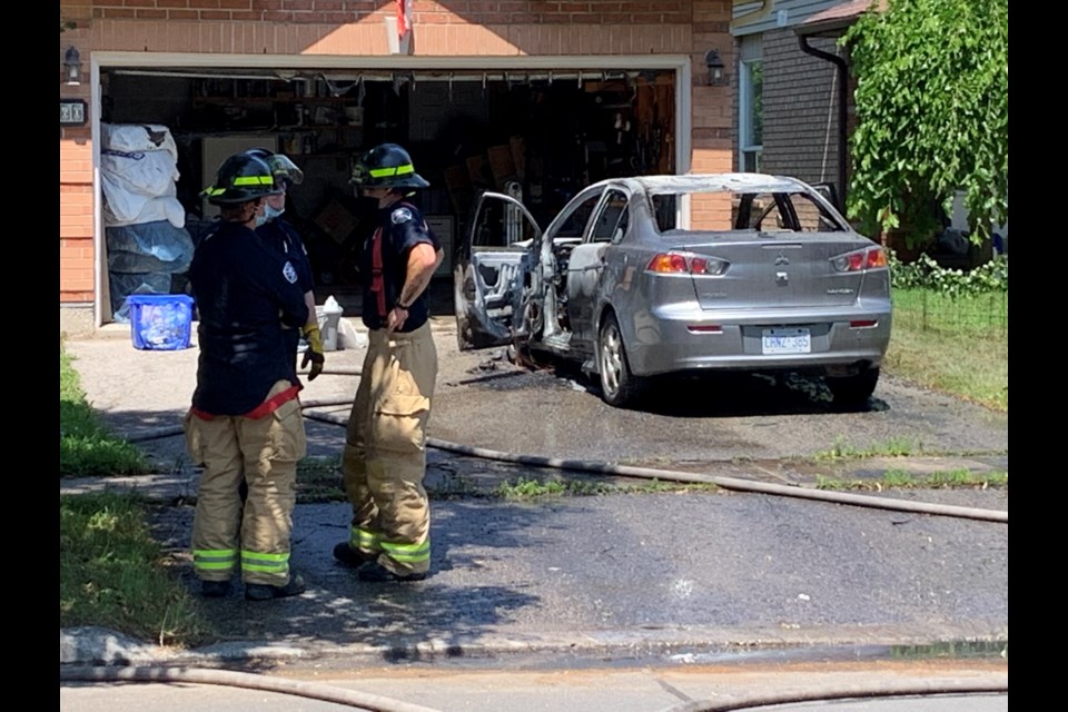 Barrie firefighters at an Arthur Avenue car fire Saturday afternoon