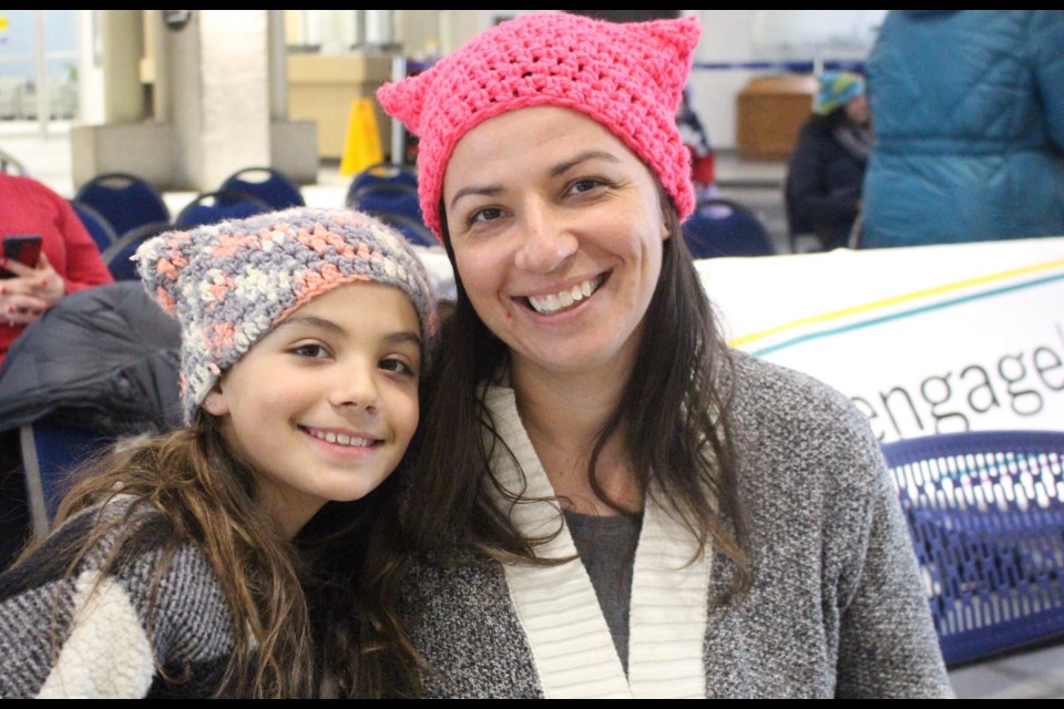 Oro-Medonte resident Lindsay Danko and her daughter Lilah Simpson took part in the International Women's Day parade, hosted by the Women and Children's Shelter of Barrie on Wednesday.