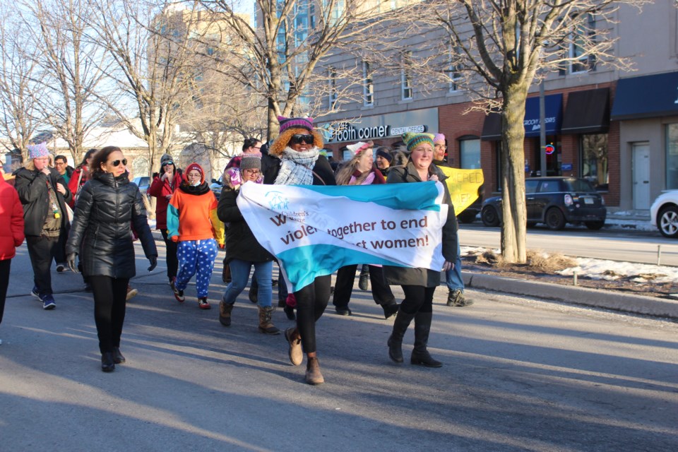 Participants in the International Women's Day parade, hosted by the Women and Children's Shelter of Barrie, head out on a march around downtown Barrie on Wednesday, March 8, 2023.