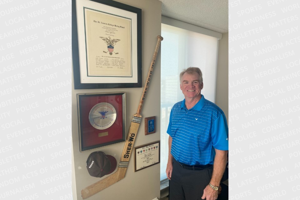 Mike Laycock is shown in front of memorabilia in his Barrie home.