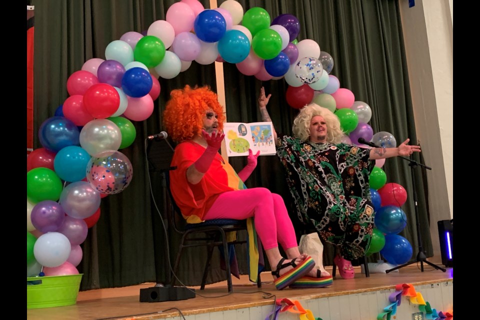 Drag stars Fay Slift and Fluffy Soufflé read stories to the crowd at the inaugural drag queen story time hosted by the Springwater Public Library on Friday in Elmvale.