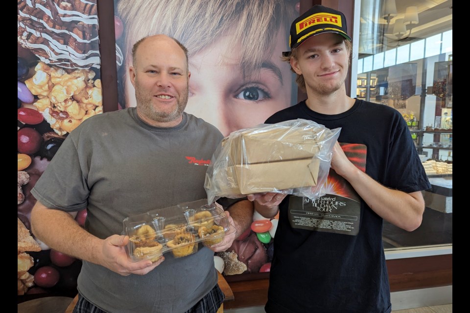 Doug (left) and Griffin Todgham show off their butter tarts