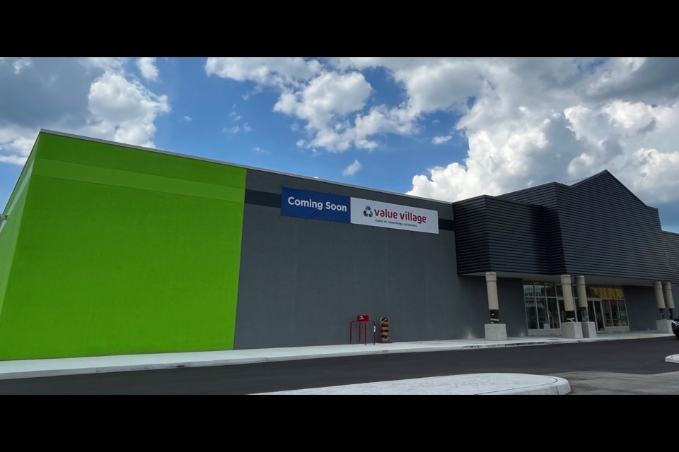 A 'Coming Soon' banner hangs outside a new Value Village store at 42 Caplan Ave.
