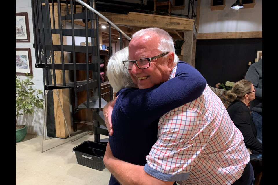 Gerry Marshall hugs his wife, Jan, Monday night after learning he did not win his bid for mayor in Barrie's 2022 municipal election.