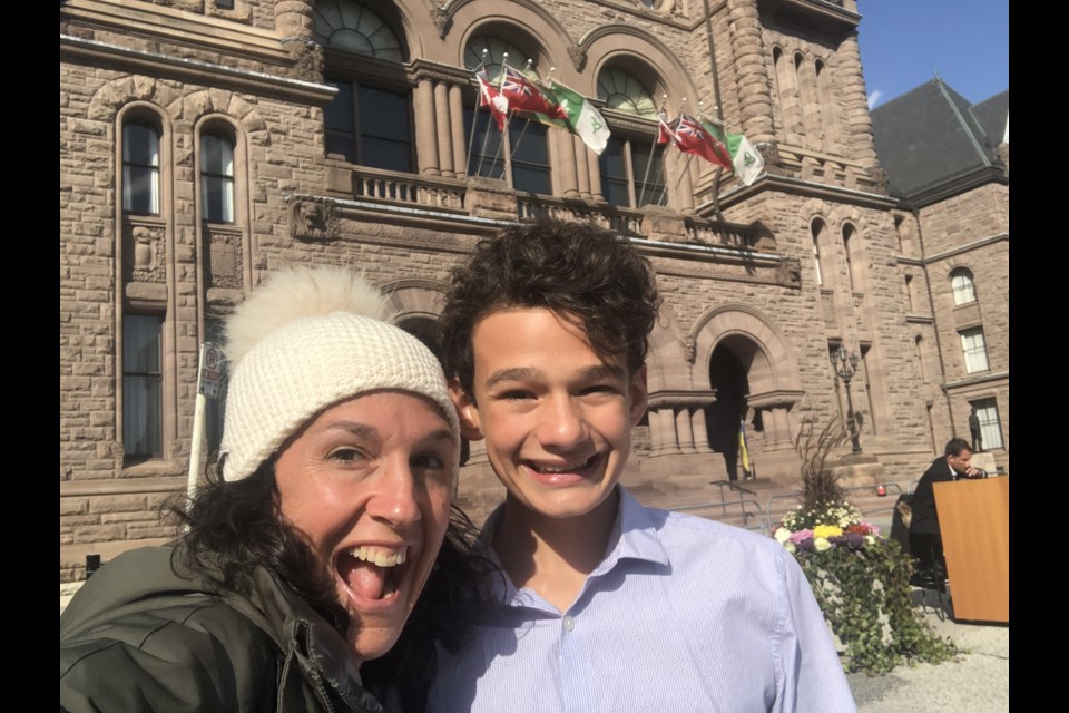 Julien Gingras, 13, with his mother Virginia, outside the Legislative Assembly of Ontario, where he spent two weeks as a page.