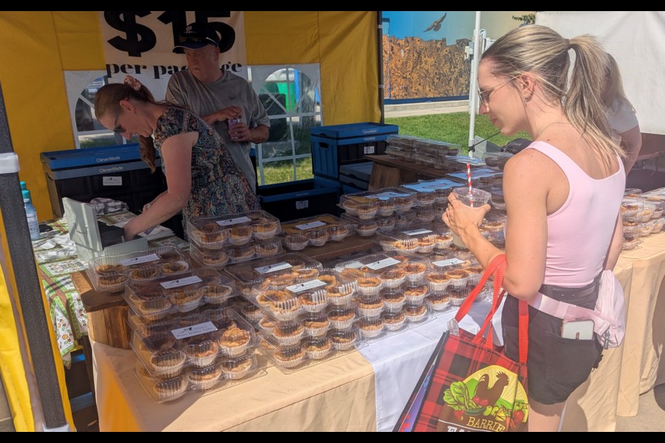 Looking over the options at the Open Air Dunlop Butter Tart Festival in downtown Barrie on Saturday.