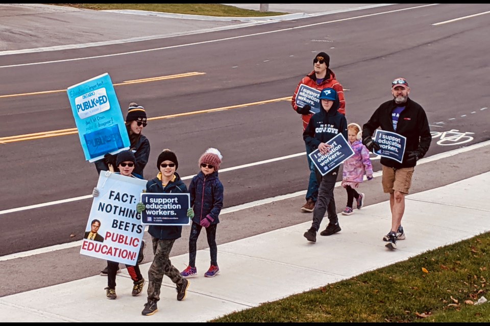 Protesters are shown Saturday morning on Bell Farm Road in Barrie.