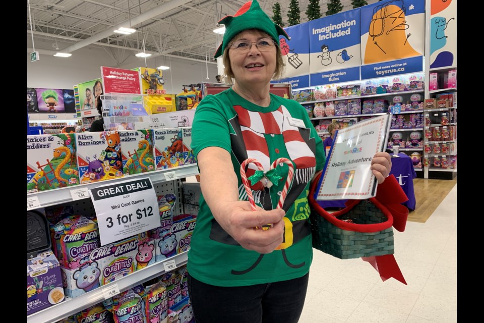 Toys R Us Park Place store manager Carmin Smith greets families 