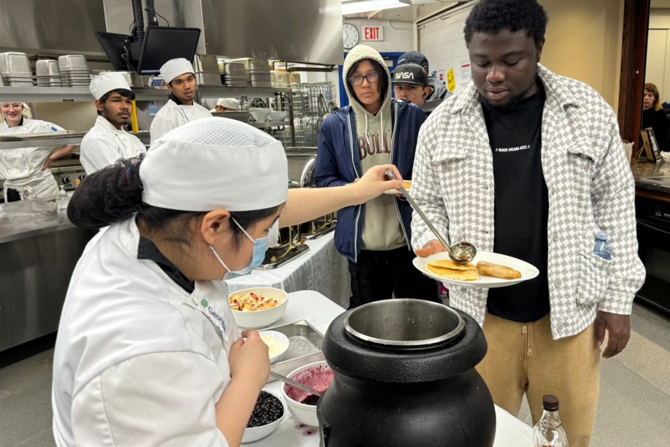 Students with Georgian's culinary program serve up a delicious pancake breakfast during Saturday's Maple Fest at Georgian College.