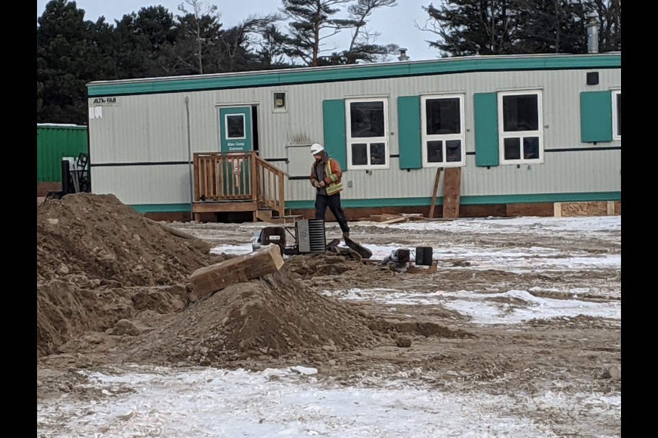 Work continued Wednesday at 20 Rose St., in Barrie, where a temporary shelter with 50 beds for the homeless is being built.
