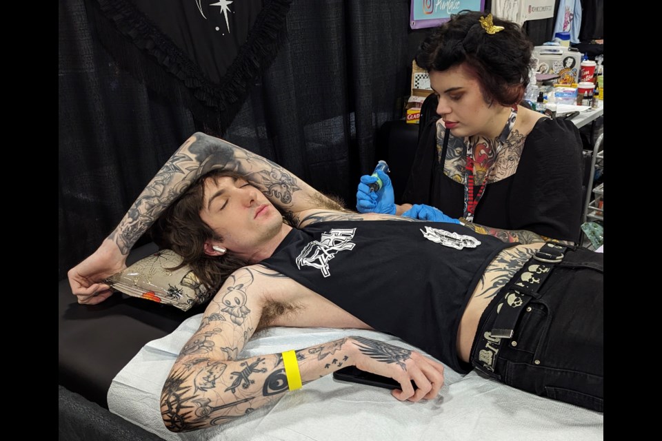Jesse Brownlee gets a tattoo from Danielle Diane at the Inked Circus Tattoo Expo in Barrie on Saturday.