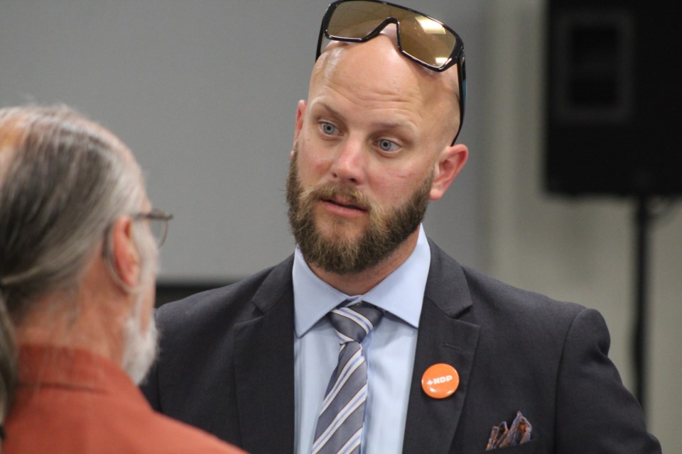 Dan Janssen, the NDP candidate in Barrie-Springwater-Oro-Medonte, speaks with a voter after last week's Barrie Chamber of Commerce debate. Raymond Bowe/BarrieToday
