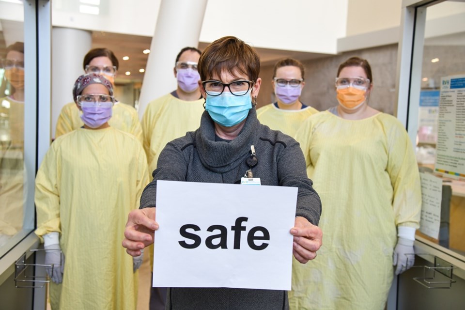 It's been an exhausting 12 months for staff at Royal Victoria Regional Health Centre (RVH) in Barrie working through a global pandemic. Shown, RVH president and CEO Janice Skot holds a 'safe' sign. 