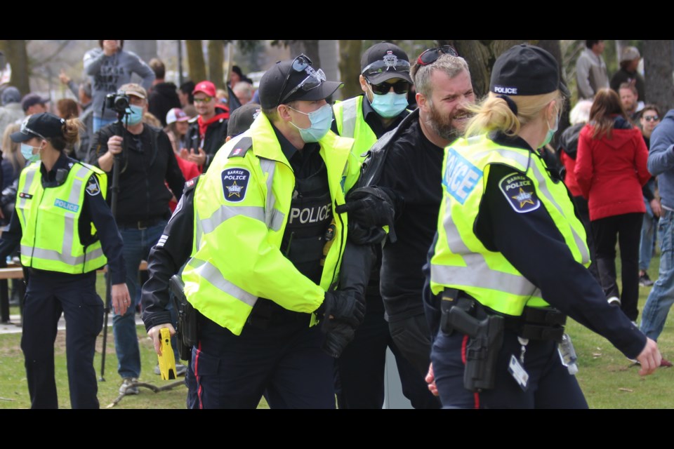 In this file photo, Stayner resident Robert MacFarlane is arrested at the May 1, 2021 'freedom rally,' which moved from Meridian Place to Centennial Park.