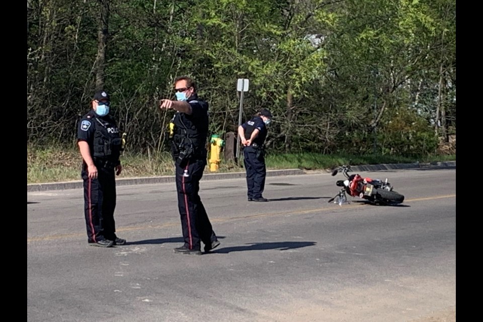 Barrie police are investigating a collision between a motorcycle and a pedestrian that sent both to hospital, Tuesday afternoon. 